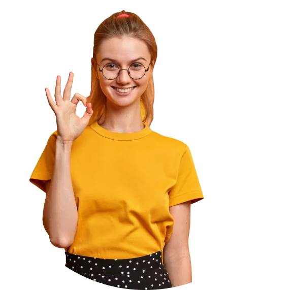 A woman in a yellow dress working on digital marketing campaigns and explainer videos.